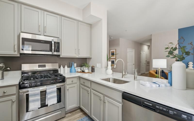a kitchen with white cabinets