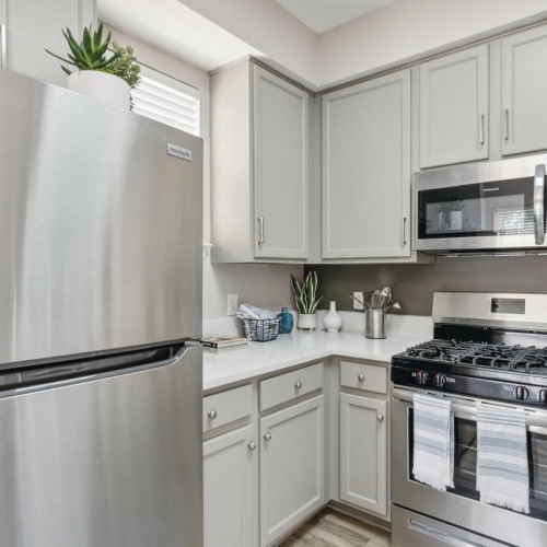 a kitchen with white cabinets