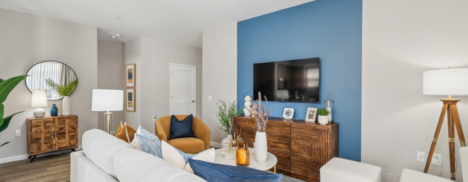 a living room with a blue wall